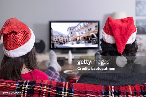 Kids watching tv at home in the Christmas night Kids watching tv at home in the Christmas night