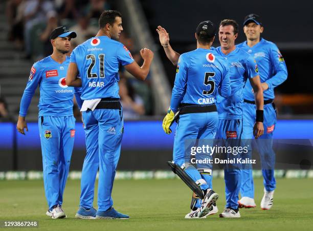 Wes Agar of the Adelaide Strikers and Alex Carey of the Adelaide Strikers celebrate during the Big Bash League match between the Adelaide Strikers...