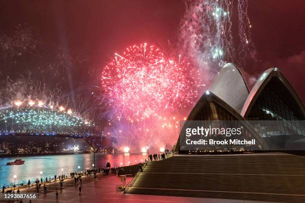 The Sydney Harbour fireworks display is seen over a near-empty Sydney Opera House forecourt during New Year's Eve celebrations on January 01, 2021 in...