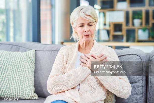 this does not feel normal - senior inhaling stock pictures, royalty-free photos & images