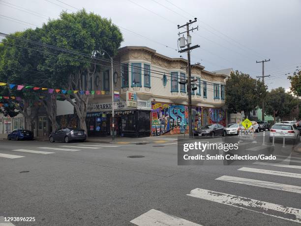 Photograph of a building decorated with a Mission mural on the corner of 24th and Shotwell Street in the Mission District in San Francisco,...