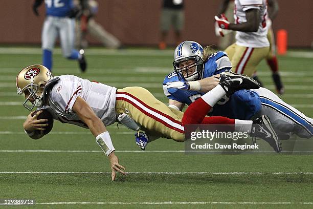 Bobby Carpenter of the Detroit Lions dives to tackle Alex Smith of the San Francisco 49ers during a NFL game against the at Ford Field on October 16,...