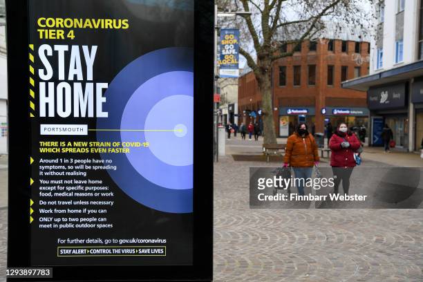 Members of the public are seen in the shopping areas around the city centre on December 31, 2020 in Portsmouth, England. From Thursday,...