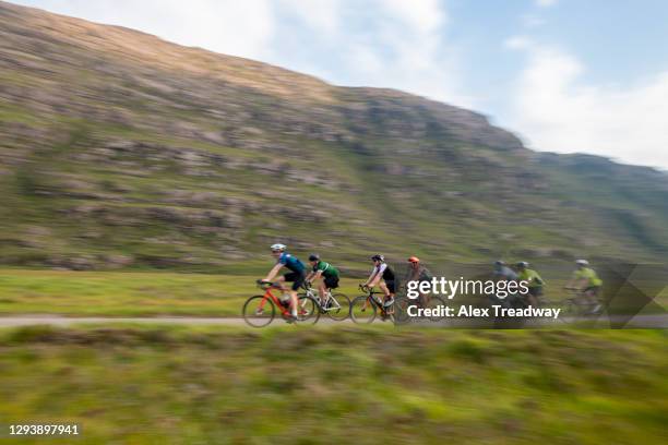 cyclists riding the north coast 500 route around scotland - cycling event stock pictures, royalty-free photos & images