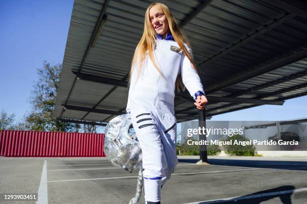 futuristic child astronaut in full-length white uniform and silver helmet outdoors. dream, future, travel and discovery concept - child in space suit stock pictures, royalty-free photos & images