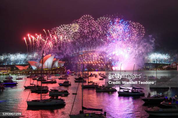 Fireworks display is seen over the Sydney Harbour Bridge during New Year's Eve celebrations on January 01, 2021 in Sydney, Australia. Celebrations...