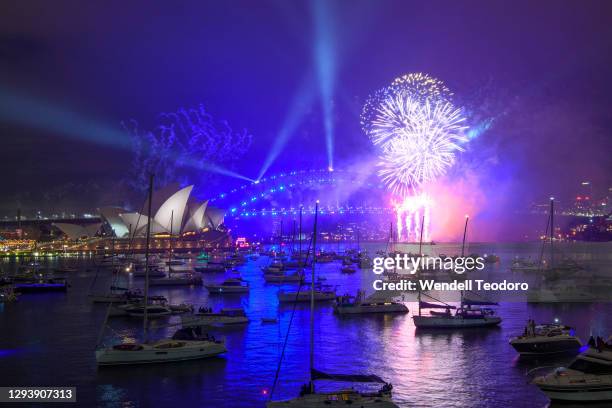 Fireworks display is seen over the Sydney Harbour Bridge during New Year's Eve celebrations on January 01, 2021 in Sydney, Australia. Celebrations...