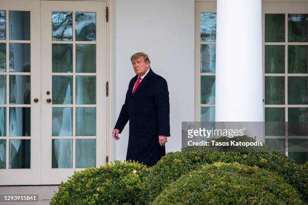 President Donald Trump walks to the Oval Office while arriving back at the White House on December 31, 2020 in Washington, DC. President Trump and...