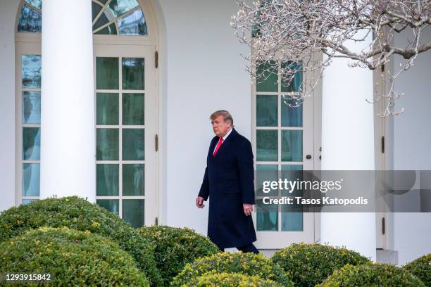 President Donald Trump walks to the Oval Office while arriving back at the White House on December 31, 2020 in Washington, DC. President Trump and...