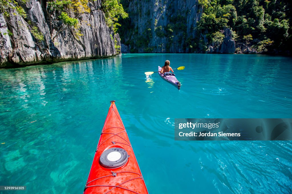 Front end of a red kayak in the Philippines.