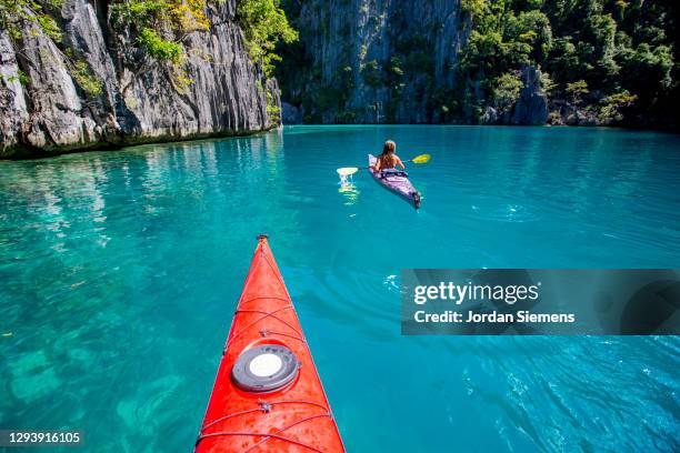 front end of a red kayak in the philippines. - daily life in manila stock pictures, royalty-free photos & images