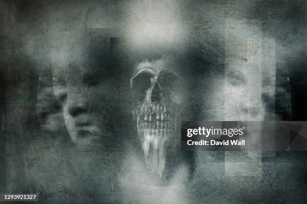 a horror concept of a scary skull. over layered with a graveyard angel. with a blurred, grunge, abstract edit. - angel dust stockfoto's en -beelden