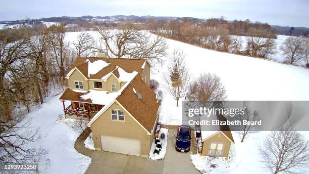 house in snowy countryside - wisconsin house stock pictures, royalty-free photos & images