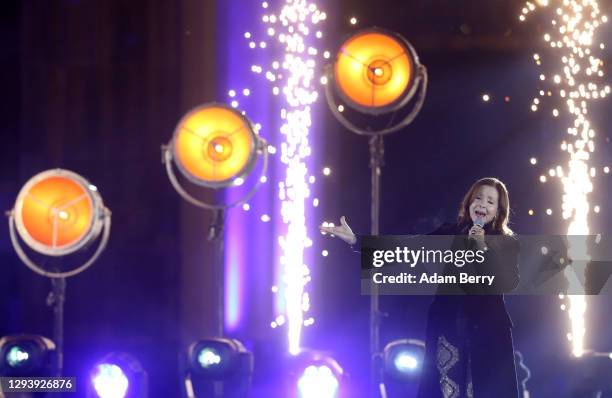 Vicky Leandros performs during the "Willkommen 2021" performance behind the Brandenburg Gate on December 31, 2020 in Berlin, Germany. Due to the...