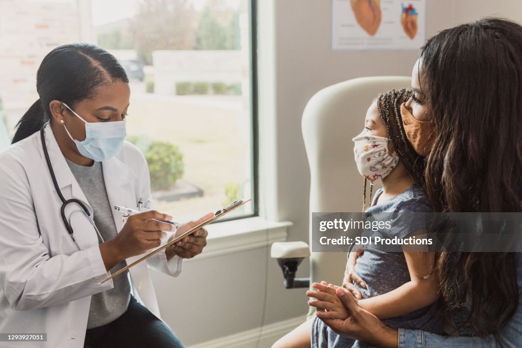 Mother and daughter answer doctor's questions