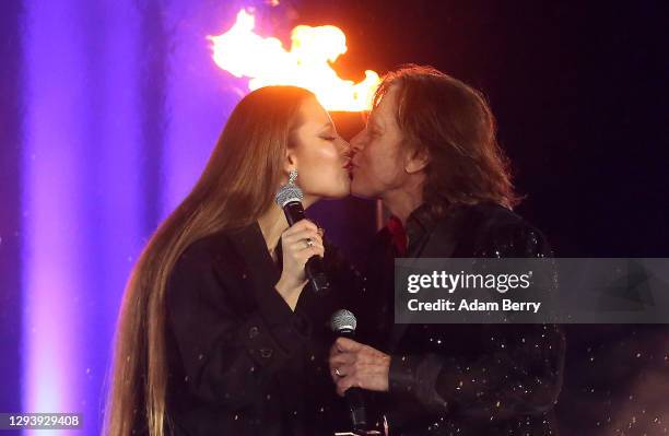 Jürgen Drews performs with his daughter Joelina Drews during the "Willkommen 2021" performance behind the Brandenburg Gate on December 31, 2020 in...