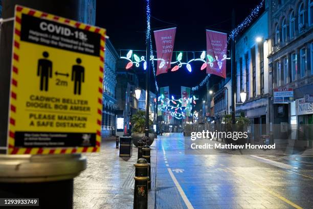 An empty St. Mary's Street in central Cardiff on December 31 in Cardiff, Wales. Wales went into a Level 4 lockdown from midnight on December 19. All...