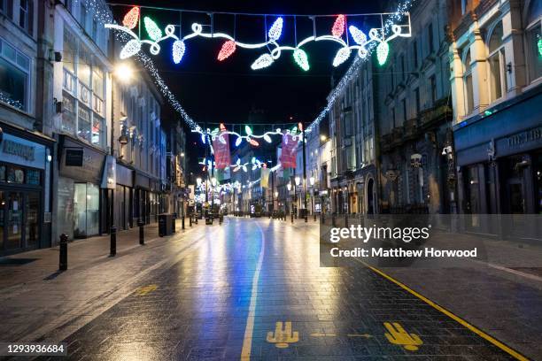 An empty St. Mary's Street in central Cardiff on December 31 in Cardiff, Wales. Wales went into a Level 4 lockdown from midnight on December 19. All...