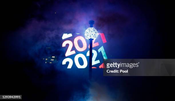 The ball is raised into place in Times Square during 2021 New Year’s Eve celebrations on December 31, 2020 in New York City.