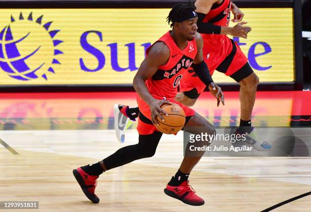 Terence Davis of the Toronto Raptors dribbles during the second half against the New York Knicks at Amalie Arena on December 31, 2020 in Tampa,...