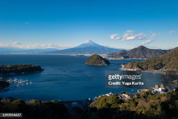 mt. fuji over the suruga bay and awashima island - izu peninsula stock pictures, royalty-free photos & images