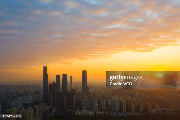 Clouds are seen over the city skyline at sunrise on New Year's Day on January 1, 2021 in Nanning, Guangxi Zhuang Autonomous Region of China.