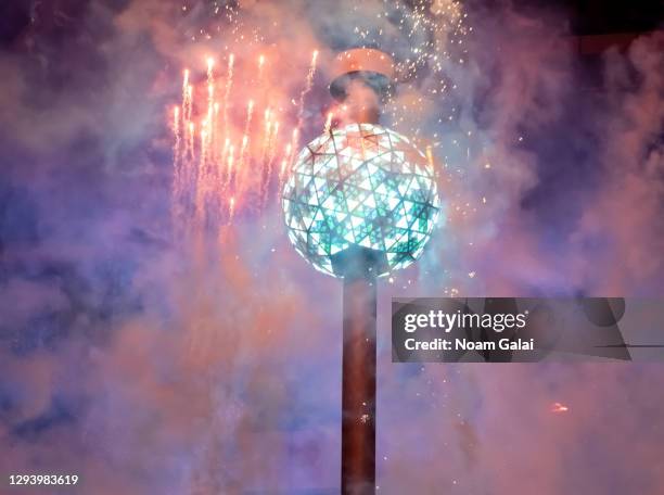 View of fireworks by the Times Square New Year’s Eve Ball during 2021 New Year's Eve celebration in Times Square on December 31, 2020 in New York...