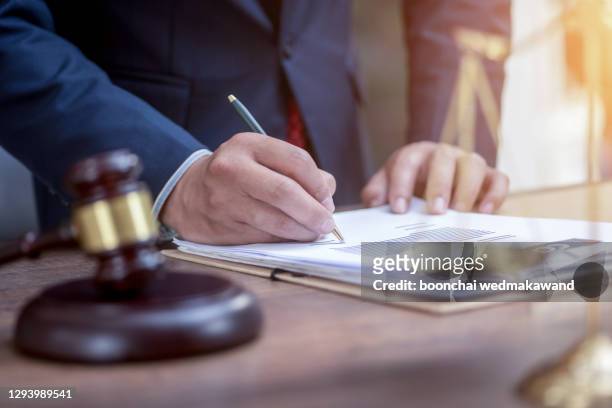 lawyer working with gavel - judges table stock pictures, royalty-free photos & images