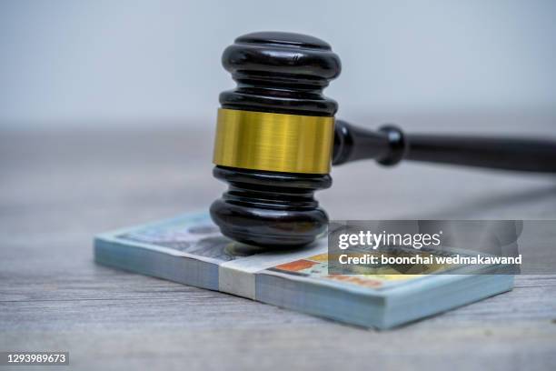 judge's hammer gavel and bank note.representation of corruption and bribery in the judiciary. - bestrafung stock-fotos und bilder