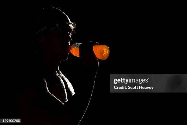 Swimmer Chris Brady of the United States drinks a Gatorade in the practice pool during Day Two of the XVI Pan American Games at Scotiabank Aquatics...