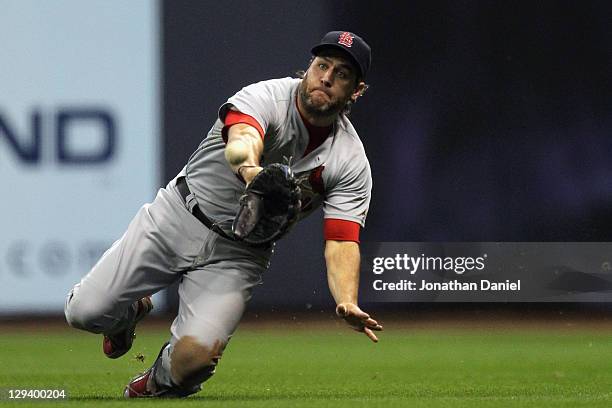 Lance Berkman of the St. Louis Cardinals catches a fly ball hit by Corey Hart of the Milwaukee Brewers for the third out in the bottom of the second...