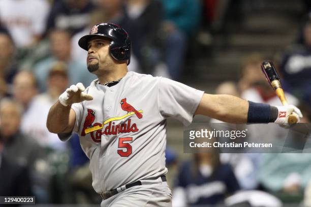 Albert Pujols of the St. Louis Cardinals hits a solo home run in the top of the third inning against the Milwaukee Brewers during Game Six of the...