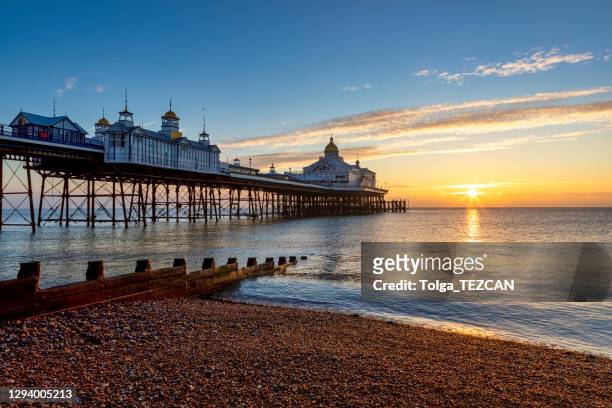 eastbourne pier at sunrise. - sussex stock pictures, royalty-free photos & images