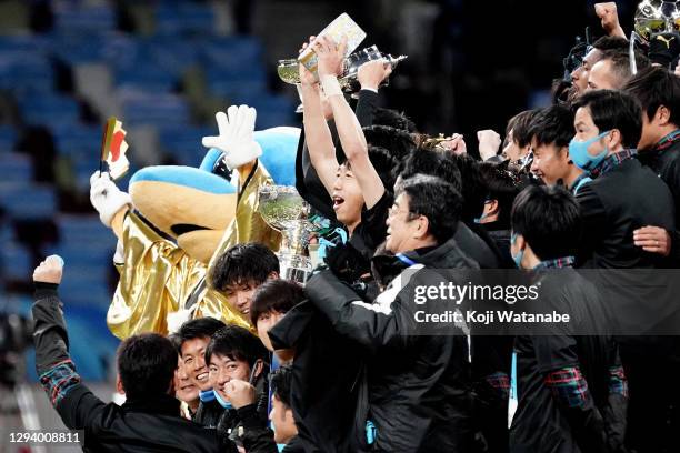 Kengo Nakamura of Kawasaki Frontale lifts the trophy as they celebrate the 100th Emperor's Cup after the 100th Emperor's Cup final between Kawasaki...