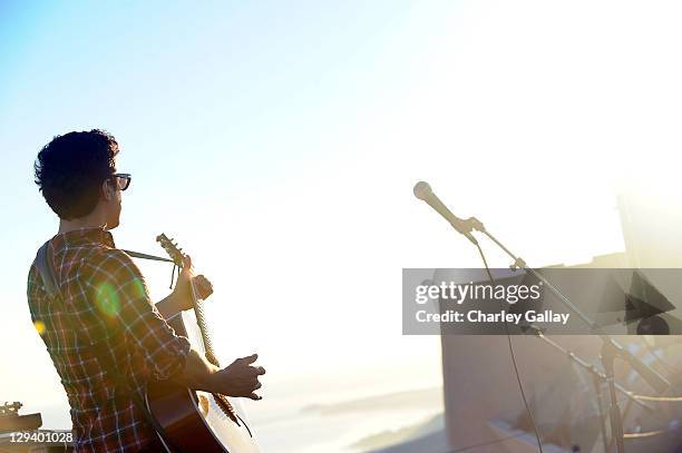 Musician M. Ward performs at the 10 Years of Toyota Prius Anniversary Celebration at Wright Organic Resource Center on October 10, 2010 in Malibu,...