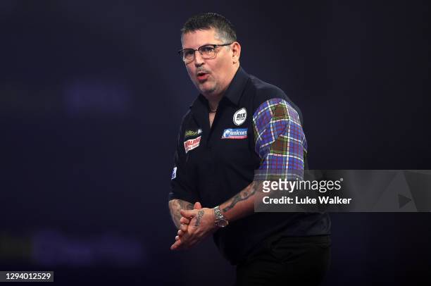 Gary Anderson of Scotland reacts during his Quarter Finals match against Dirk van Duijvenbode of The Netherlands during Day Fourteen of the PDC...
