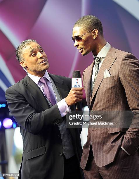 Former NBA player Rick Fox and NBA player Chris Bosh of the Miami Heat arrive at the T-Mobile Magenta Carpet at the 2011 NBA All-Star Game at L.A....