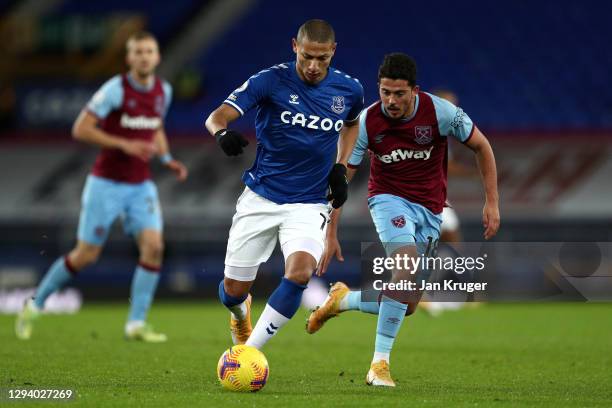 Richarlison of Everton is put under pressure by Pablo Fornals of West Ham United during the Premier League match between Everton and West Ham United...