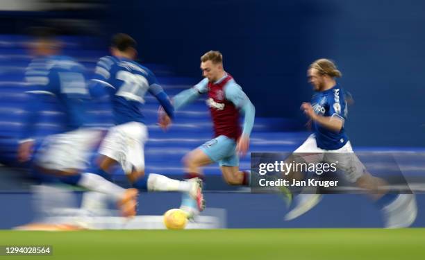 Jarrod Bowen of West Ham United is put under pressure by Tom Davies and Ben Godfrey of Everton during the Premier League match between Everton and...