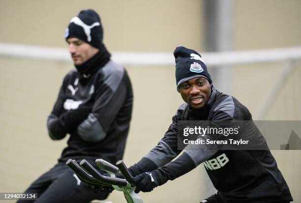 Christian Atsu sits on a spinning bike during the Newcastle United Training Session at the Newcastle United Training Centre on January 01, 2021 in...