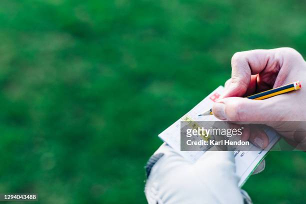 golf, marking a score card - stock photo - scoring stock pictures, royalty-free photos & images