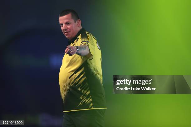 Dave Chisnall of England walks into the arena during his Quarter Finals match against Michael van Gerwen of The Netherlands during Day Fourteen of...