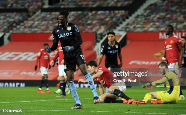 Bertrand Traore of Aston Villa celebrates after scoring their team's first goal during the Premier League match between Manchester United and Aston...