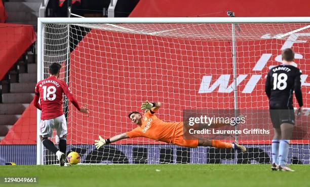 Bruno Fernandes of Manchester United scores their team's second goal from the penalty spot past Emiliano Martinez of Aston Villa during the Premier...