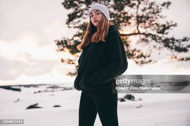 teenage girl in the snow winter landscape real people portrait - girl of desire stock pictures, royalty-free photos & images