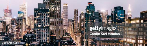 the new york skyline at night - stock photo - new york city skyline night stock pictures, royalty-free photos & images