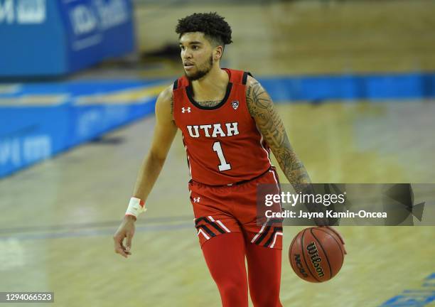 Timmy Allen of the Utah Utes takes the ball down court in the game against the UCLA Bruins at Pauley Pavilion on December 31, 2020 in Los Angeles,...