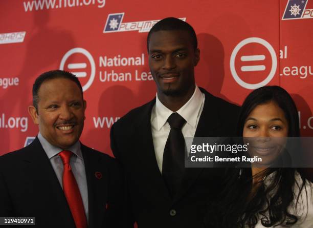 Marc H. Morial, President of the National Urban League; Former NFL player Plaxico Burress and Tiffany Burress attend a press conference at National...