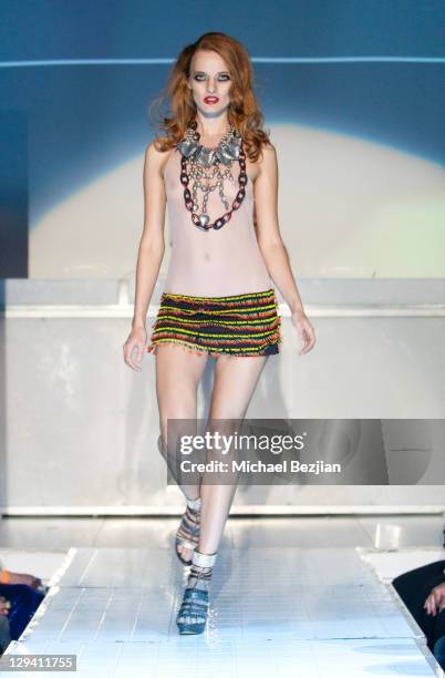 Model walks the runway wearing Maggie Barry at Maggie Barry's 50th Birthday And Fashion Extravaganza at SupperClub Los Angeles on May 14, 2011 in Los...