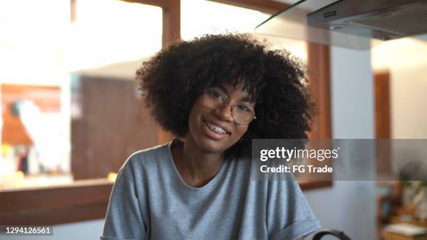 portrait of a teenager girl at home - black teenage girl stock pictures, royalty-free photos & images